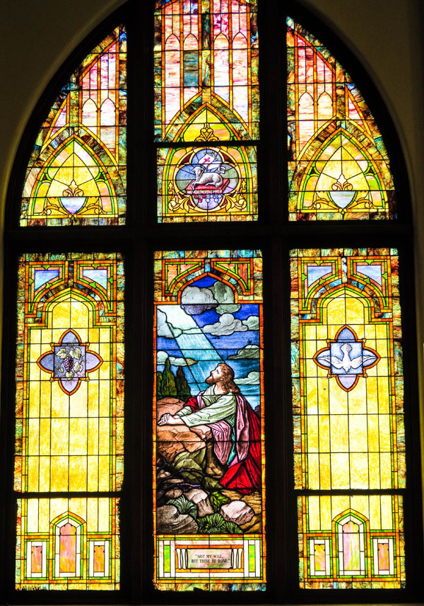 A second beautiful stained glass window with intricate details.