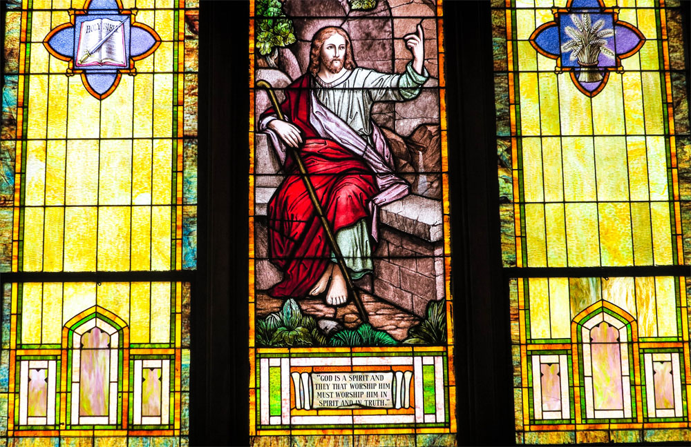 A third stained glass window, showing another biblical story.